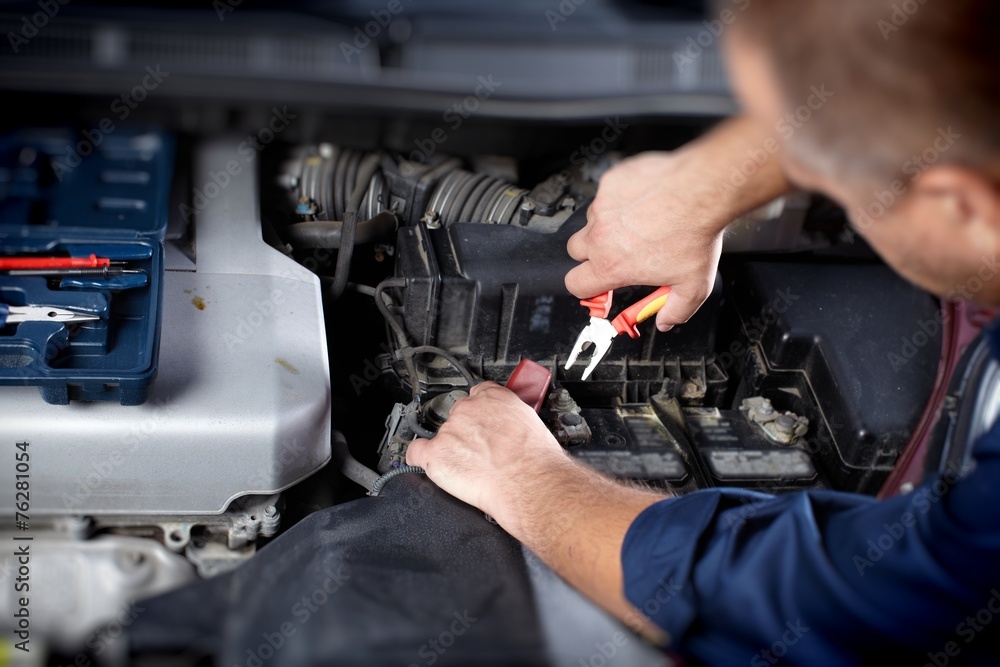 Mechanic working in auto repair garage Mechanic working in auto repair garage