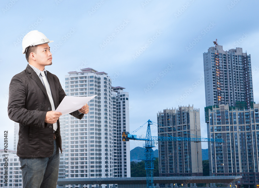 engineering man wearing western suit and safety helmet with buil engineering man wearing western suit and safety helmet with buil