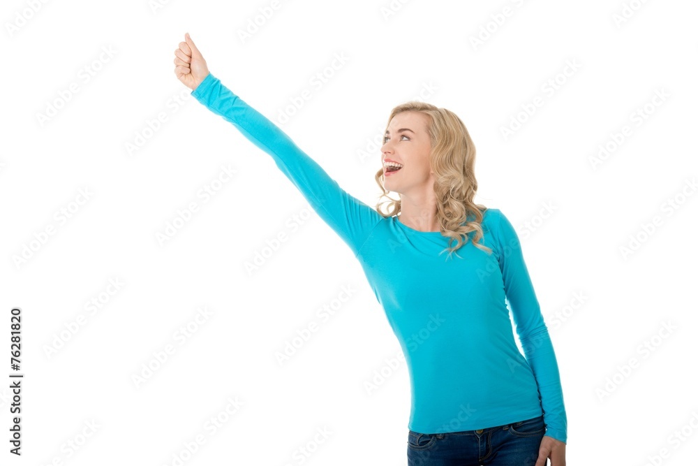 Full length woman making winner gesture Full length woman making winner gesture