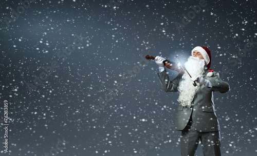 Santa play violin © Sergey Nivens