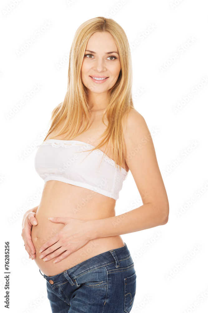 Happy pregnant woman looking at camera Happy pregnant woman looking at camera