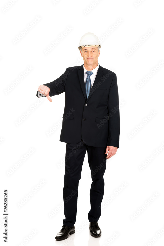 Construction businessman showing thumbs down Construction businessman showing thumbs down