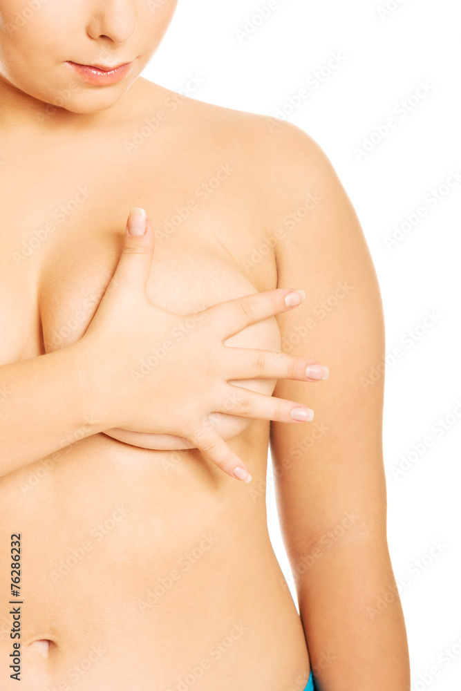 Overweight woman covering her breast Overweight woman covering her breast