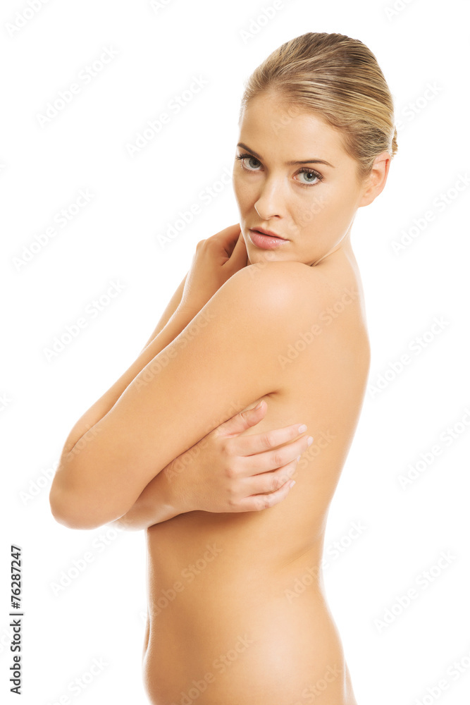 Topless woman covering her breast Topless woman covering her breast