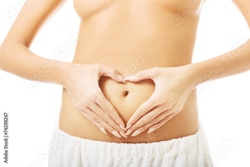 Wallpaper Mural Close up female making heart shape on belly Torontodigital.ca