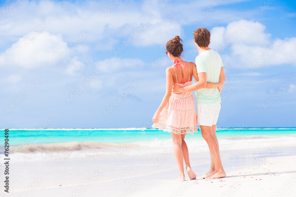 picture of happy couple in sunglasses on the beach