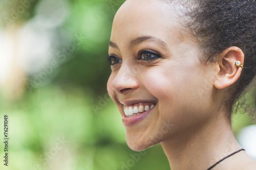 Beautiful Mixed-Race Young Woman at Park  Smiling Portrait