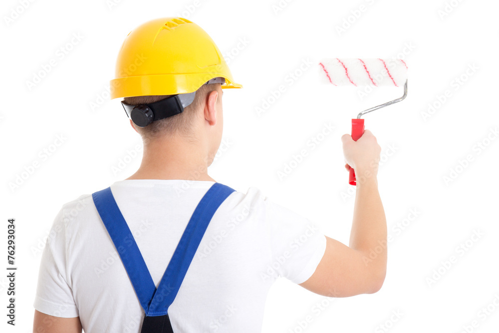 back view of man painter in workwear with paintbrush isolated on back view of man painter in workwear with paintbrush isolated on