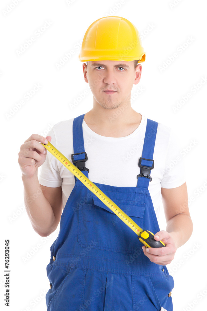 man builder in blue coveralls holding measure tape isolated on w