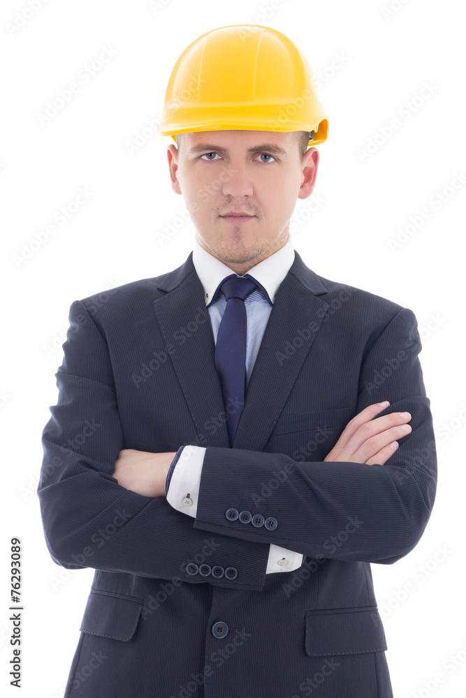 young handsome business man in yellow builder's helmet isolated young handsome business man in yellow builder's helmet isolated