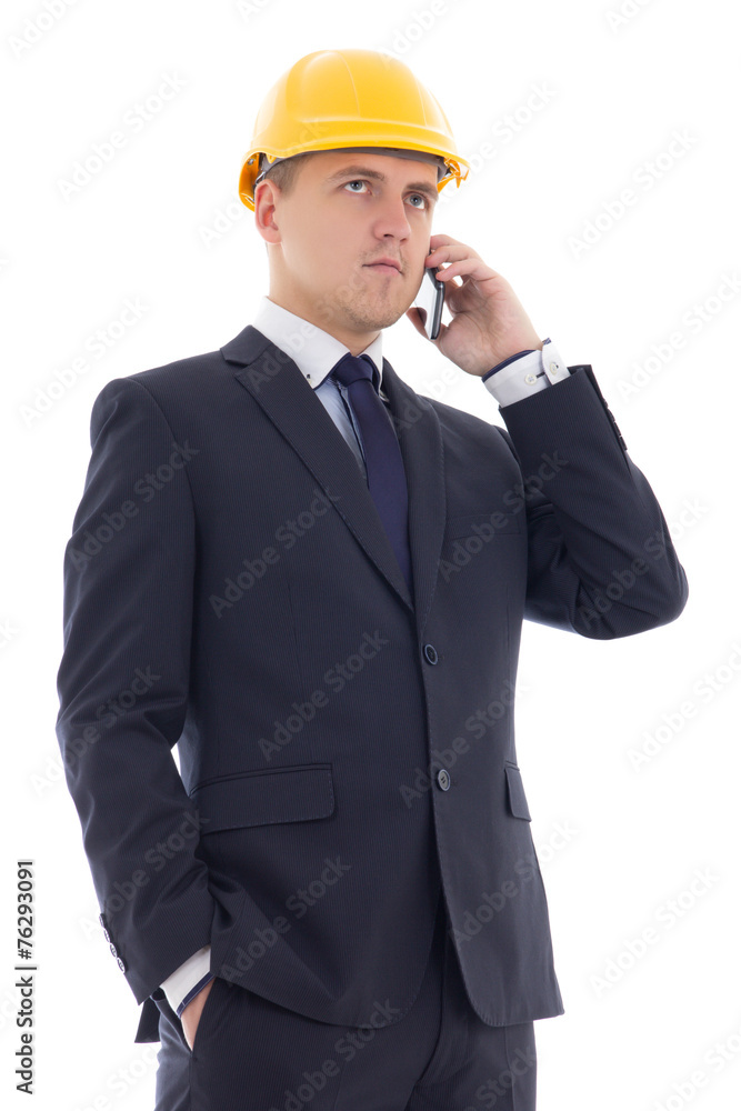 young handsome business man in yellow builder's helmet talking b young handsome business man in yellow builder's helmet talking b