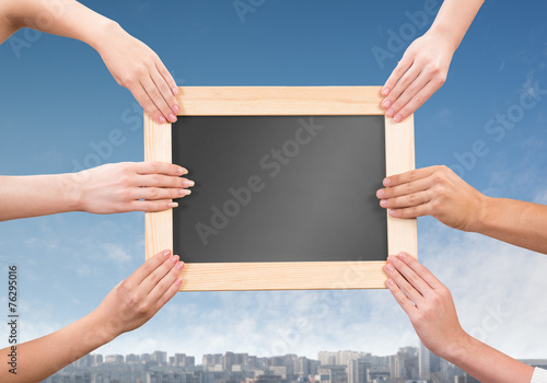 Hands holding frame