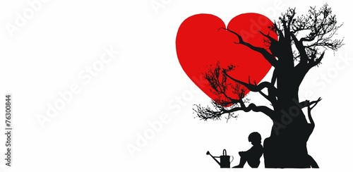 Child under a tree with heart photo