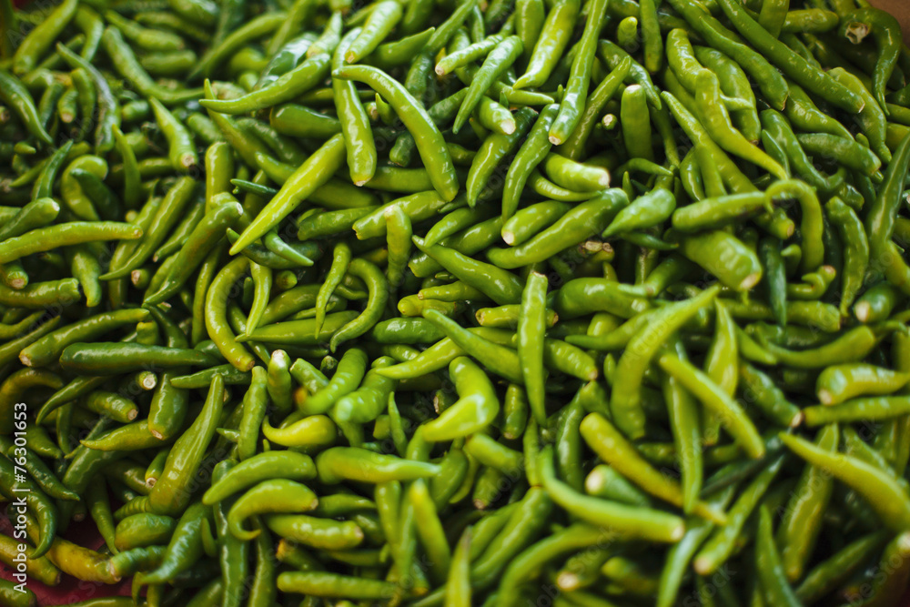 Green chilli peppers on heap. Green chilli peppers on heap.