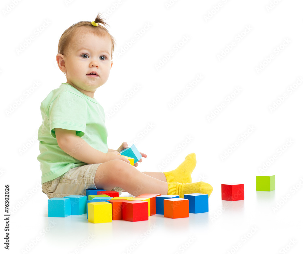 baby playing with colorful blocks isolated