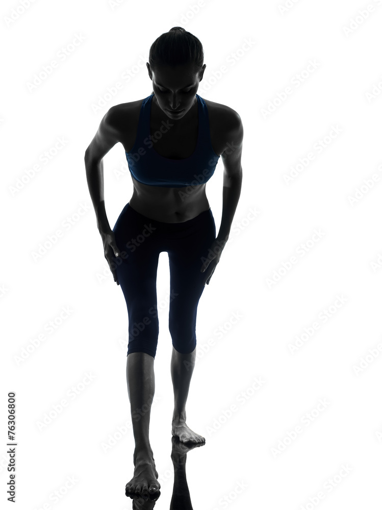 Fototapeta premium woman exercising yoga warrior position silhouette