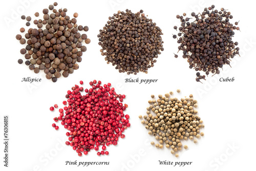 Piles of spice on white background