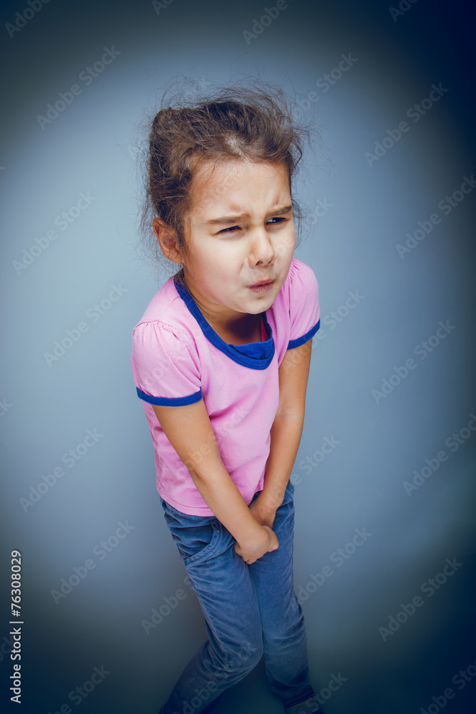 girl child badly wants the toilet on a gray background cross pro girl child badly wants the toilet on a gray background cross pro