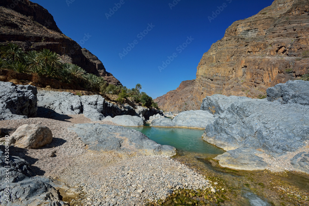Natural pool between the mountains of Oman Natural pool between the mountains of Oman