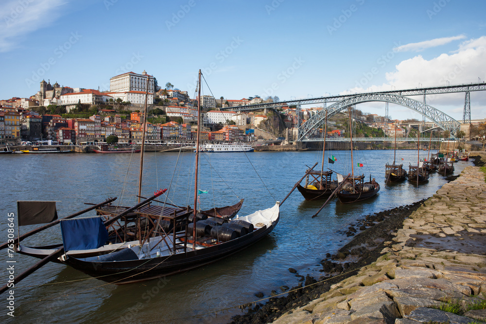 Boats on Douro River and Porto Skyline in Portugal