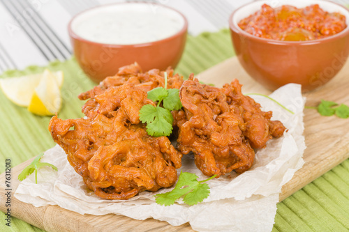 Onion Bhajis - Asian fritters with lime chutney and mint raita. photo