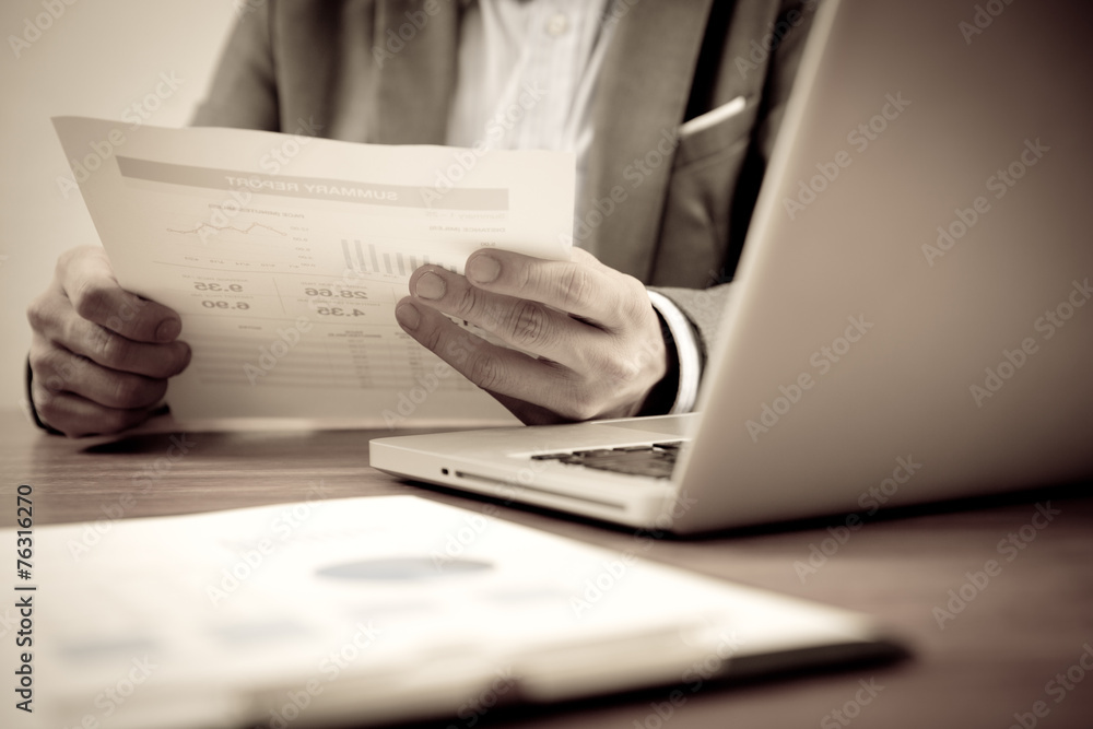 Businessman analyzing investment charts with laptop. Accounting Businessman analyzing investment charts with laptop. Accounting
