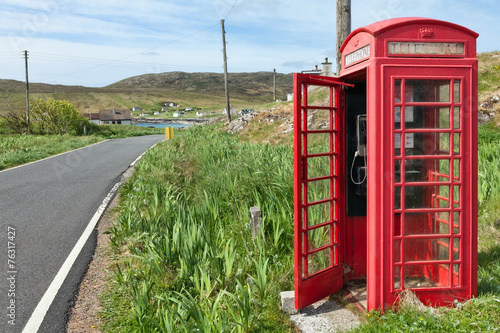 Red phone booth in scottish countryside