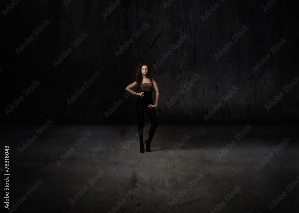 model posing in a dark room