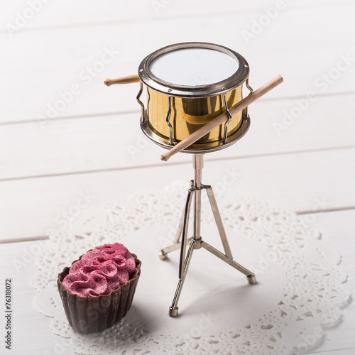 Candy and decorative drum on a paper napkin
