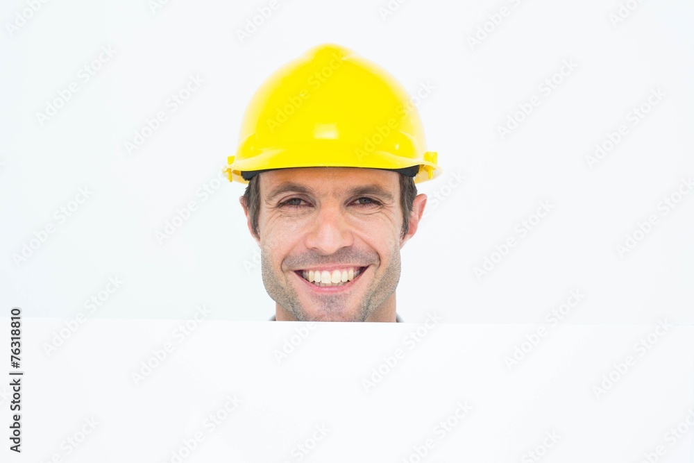 Happy architect with bill board over white background Happy architect with bill board over white background