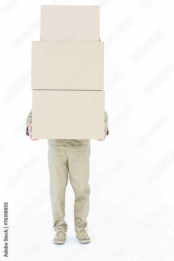 Delivery man carrying stacked boxes Delivery man carrying stacked boxes