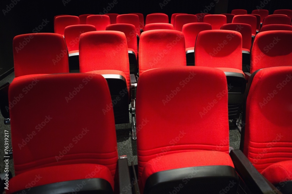 Naklejka premium Empty rows of red seats