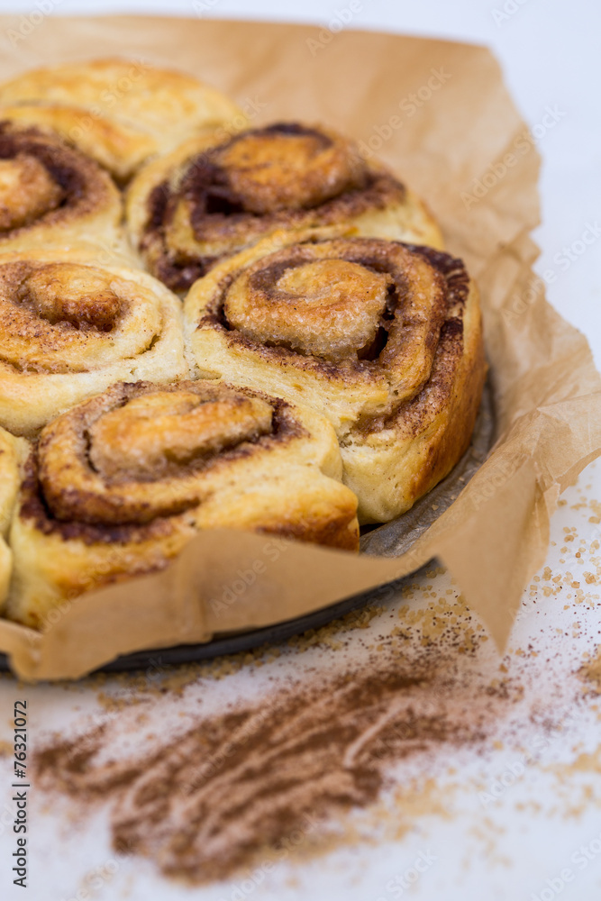 prepared cinnamon buns in brown paper prepared cinnamon buns in brown paper