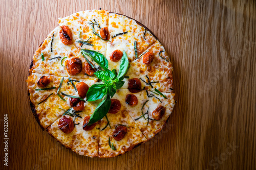 Traditional Italian pizza on wooden board