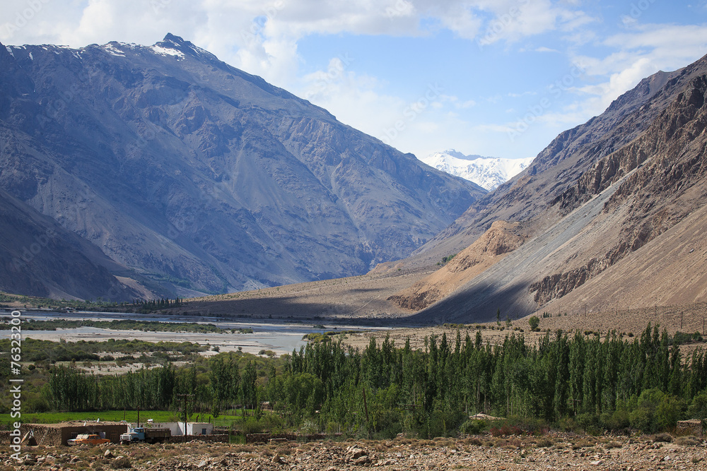 The valley at the foot of the mountains on Pamir. Spring. Tajiki
