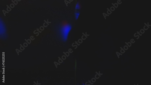 Blue disco lights reflections on wall