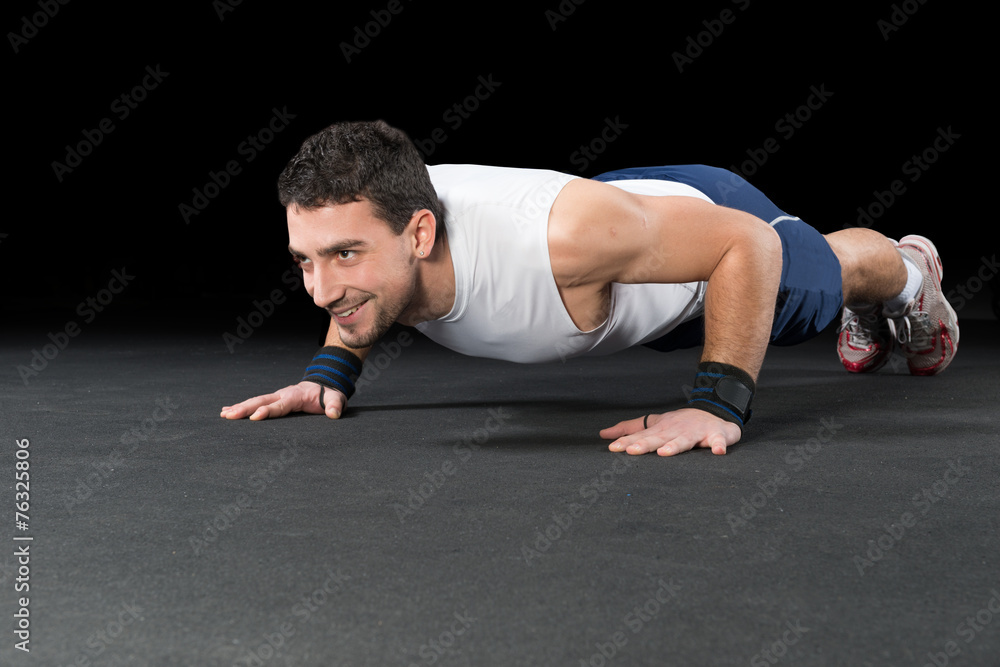 Muscular Men Doing Push-ups as part of Crossfit Training Muscular Men Doing Push-ups as part of Crossfit Training
