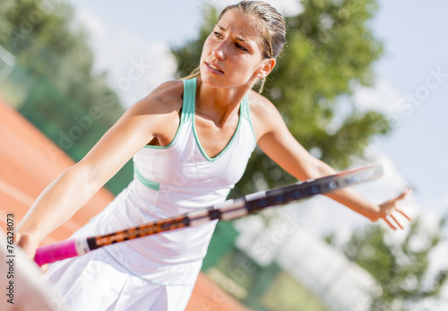 Young woman playing tennis