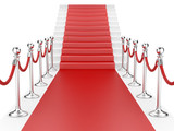 Staircase and red carpet between two metallic stanchions with ro
