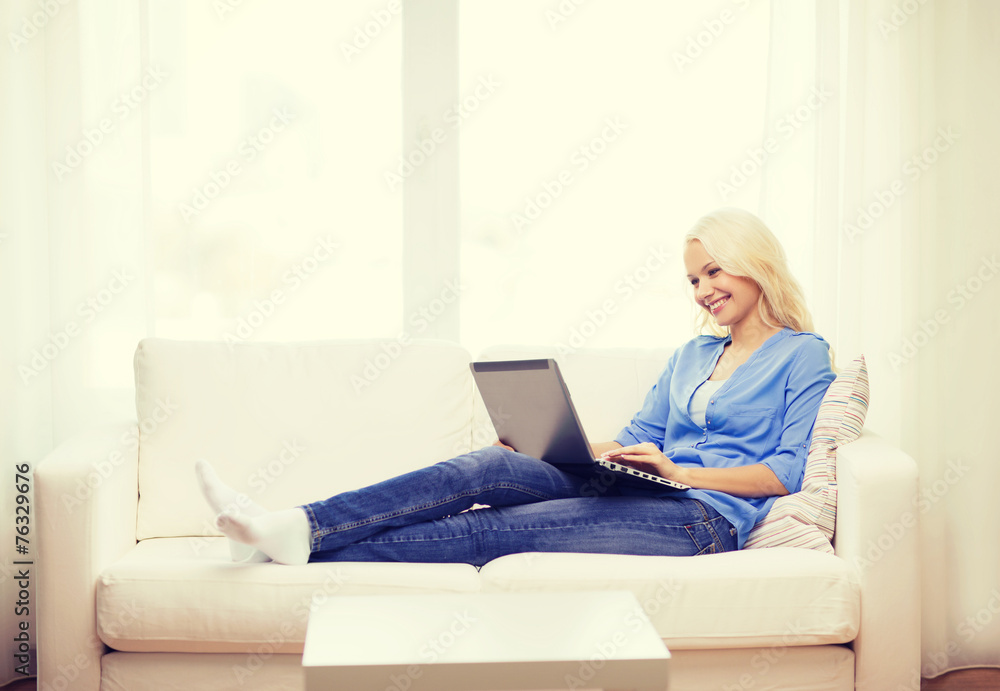smiling woman with laptop computer at home smiling woman with laptop computer at home