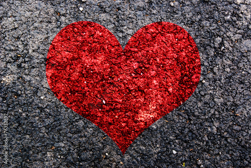 Red Heart symbol painted on asphalt