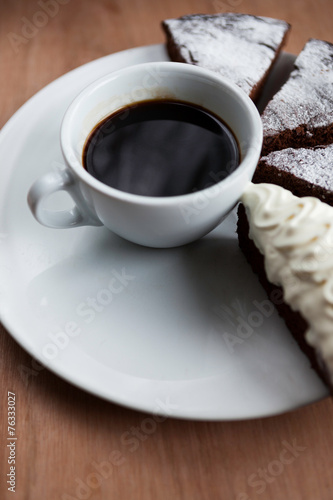 Cup of black coffee and chocolate cake