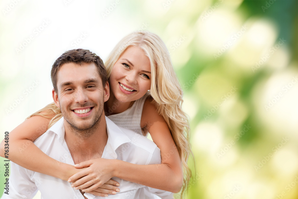 happy couple having fun over green background happy couple having fun over green background