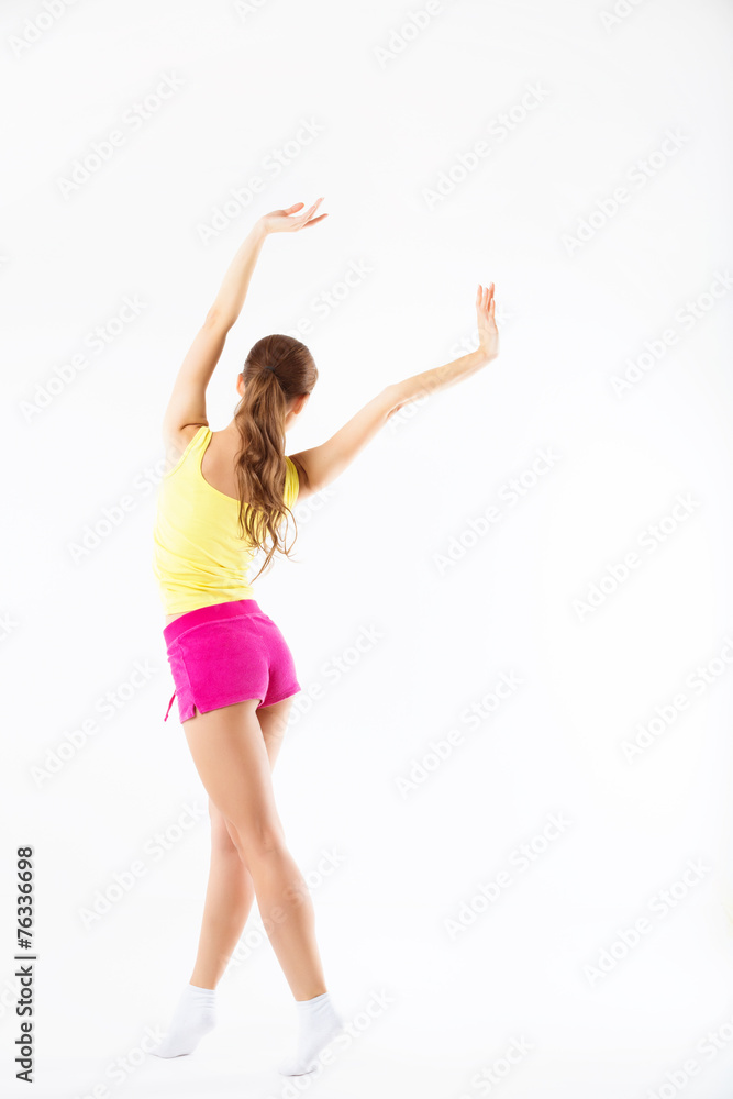 Young sporty girl in shorts isolated
