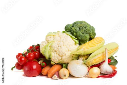 decorative pattern of fresh vegetables on white background