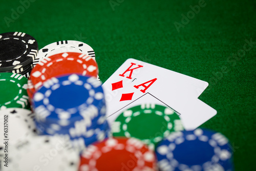 close up of casino chips and playing cards