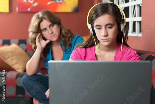 Internet addicted girl ignores her worried mother