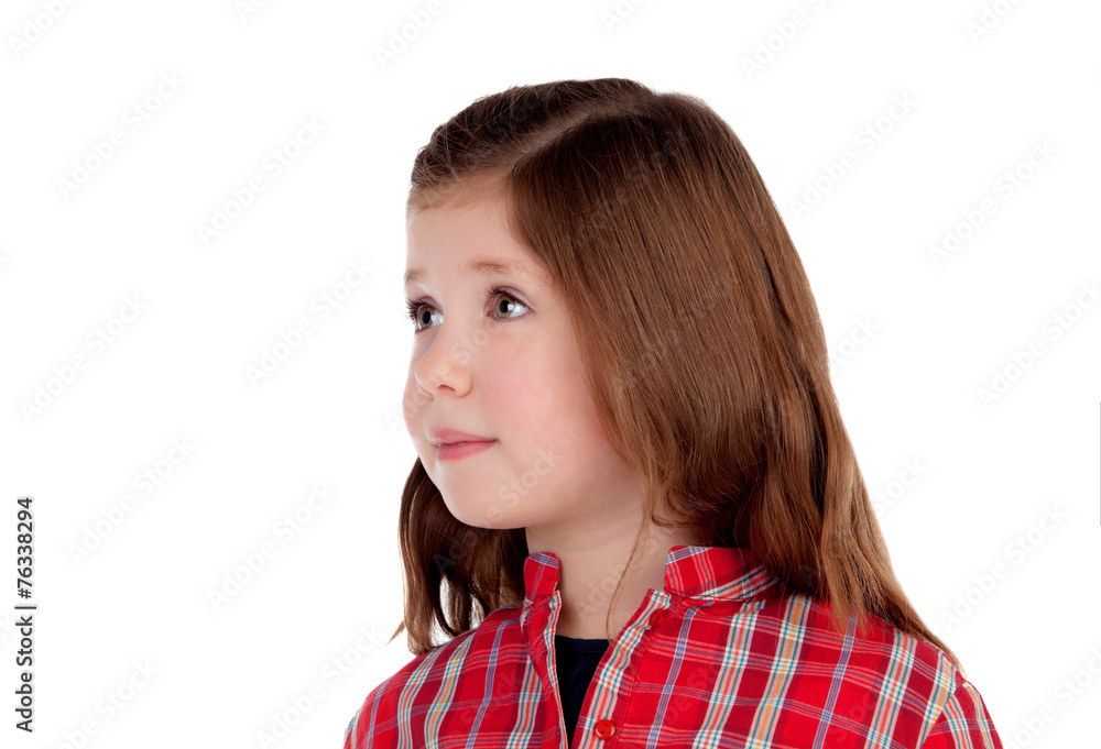 Adorable little girl with red plaid shirt looking at side Adorable little girl with red plaid shirt looking at side