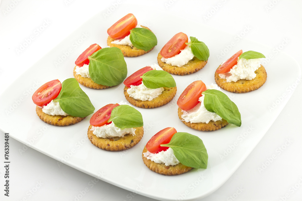 Crackers with Cheese Tomato and Basil
