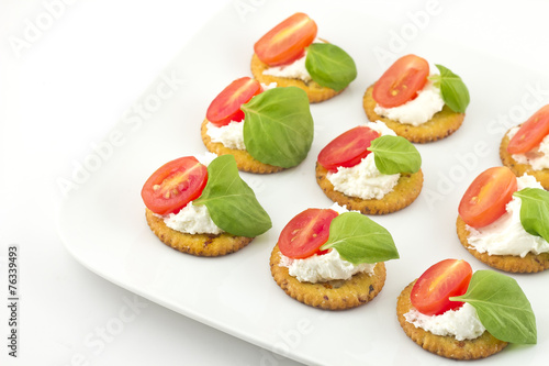 Crackers with Cheese Tomato and Basil